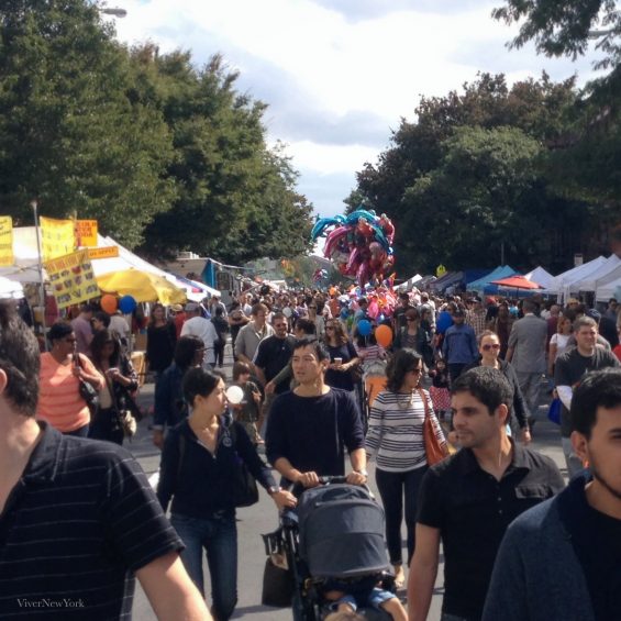Colorful vendor stalls and festivalgoers at the Atlantic Antic street fair on Atlantic Avenue, Brooklyn