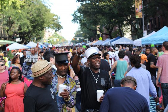 Crowds of people walking along Atlantic Avenue during the Atlantic Antic street festival in Brooklyn