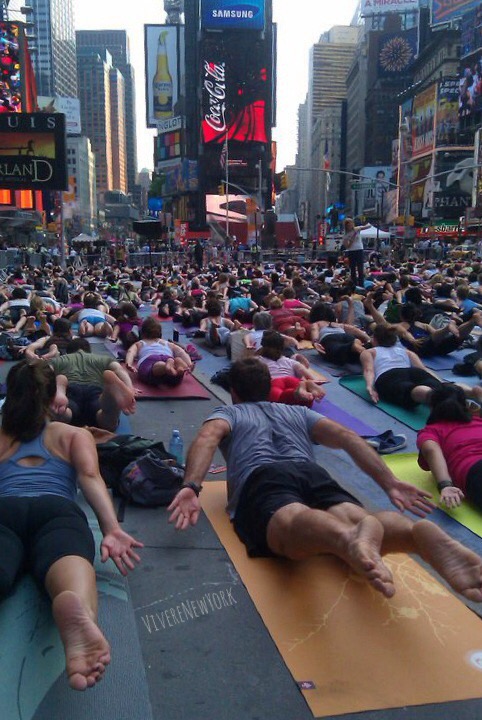 Mind Over Madness yoga Times Square NYC summer solstice crowd aerial view